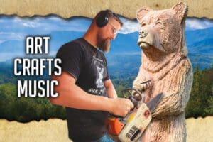 A man with headphones and a bear holding a chainsaw.