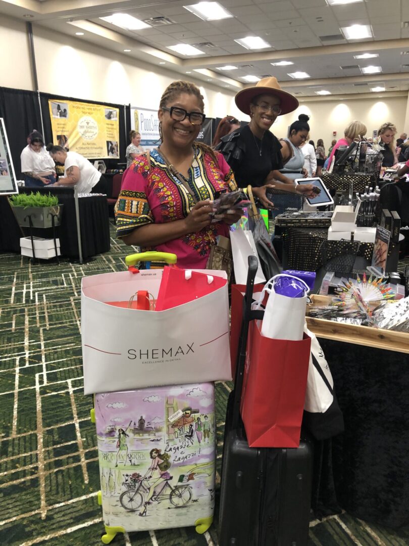 A woman standing next to a table with many bags of nail products.