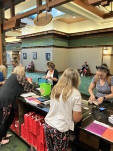 A group of people sitting at tables in a room.