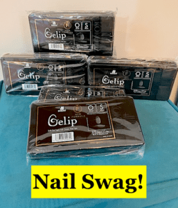 black rectangular boxes with clear plastic cover & text reading "nail swag"